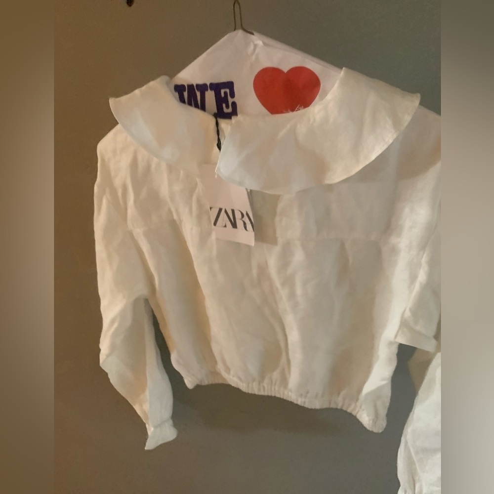 White shirt with ruffled collar, white shirt with long collar, silver skirt